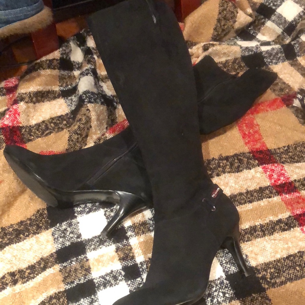 Black Calvin Klein point Rd toe thigh high boots.